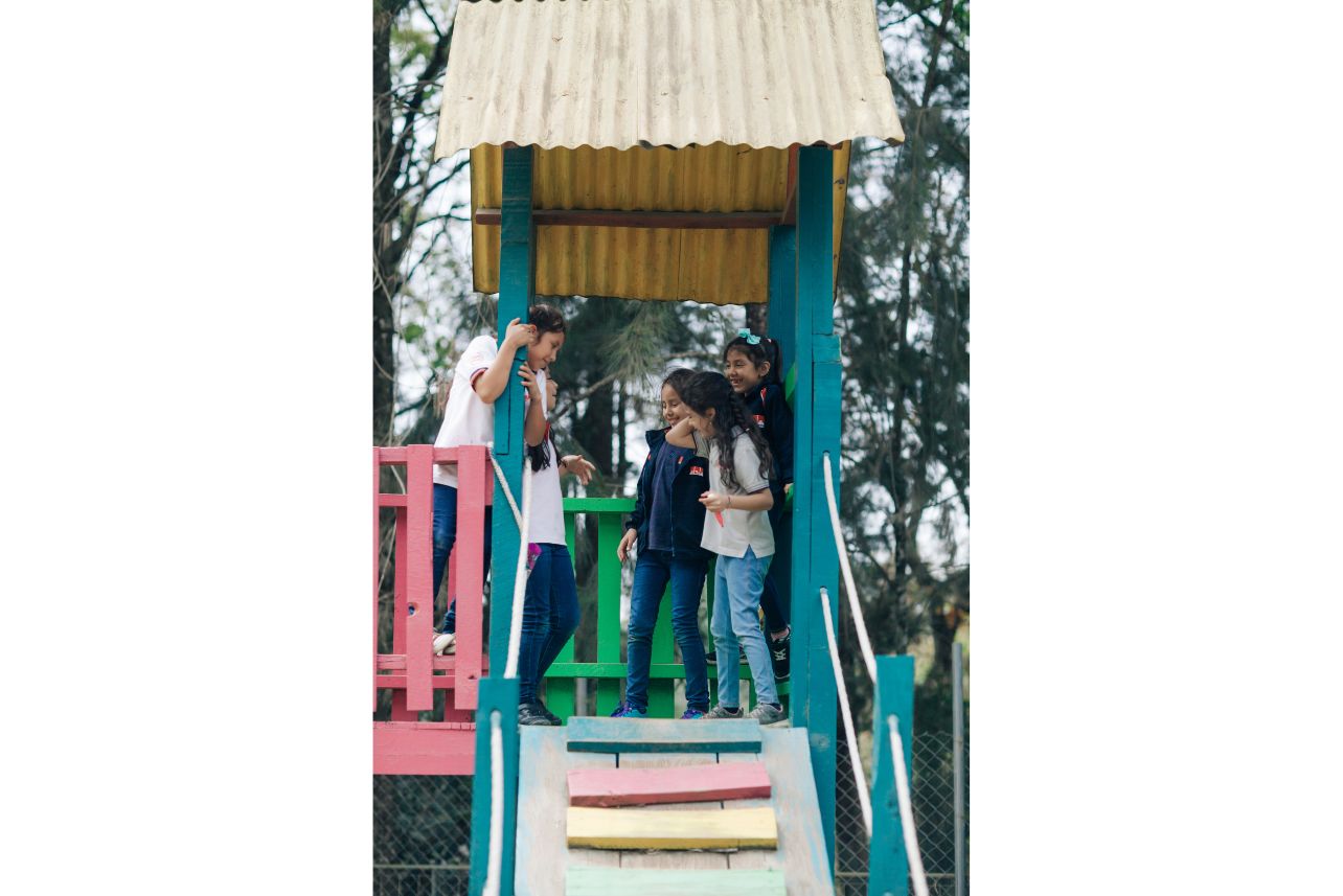 Girls playing in a playground. Girls playing in a playground.